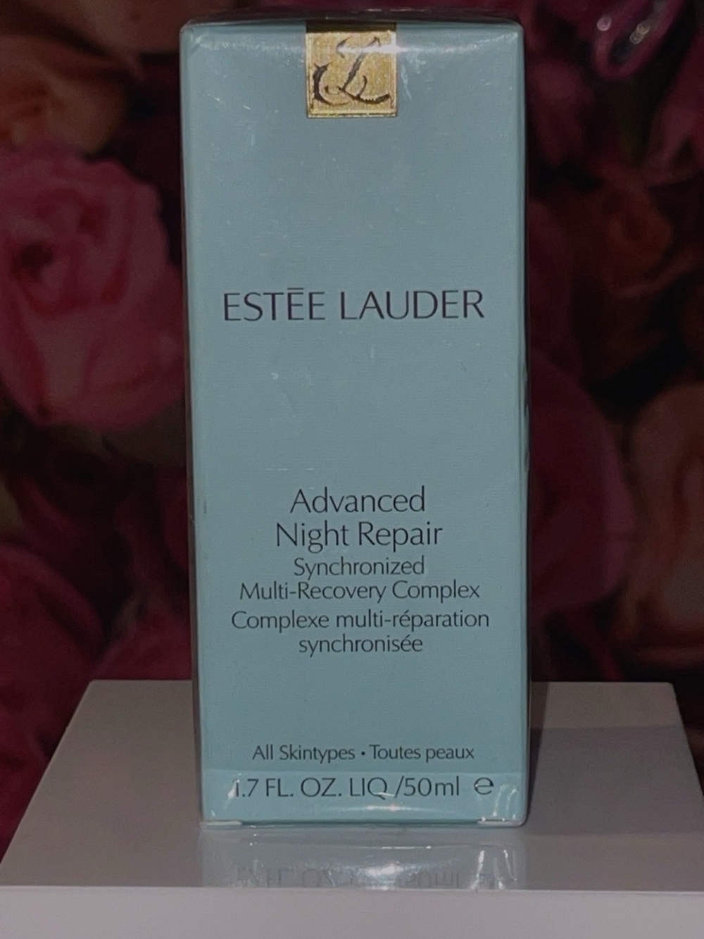 Estee Lauder light blue skincare box with white text
